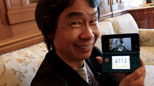 Shigeru Miyamoto with a Nintendo 3DS