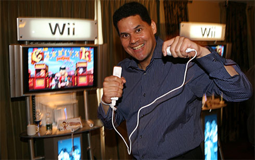 Reggie Fils-Aime playing on a Wii